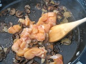 Add the chicken to the mushrooms and garlic