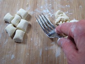 press fork into gnocchi dough