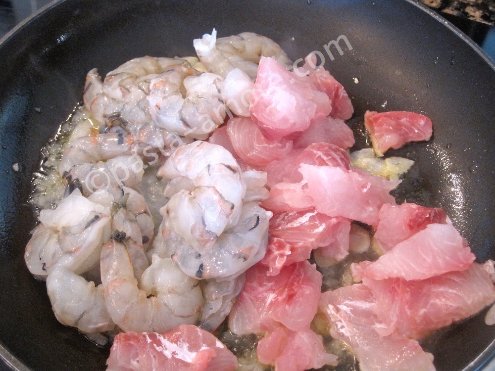 Saut�ing the seafood soup step 1