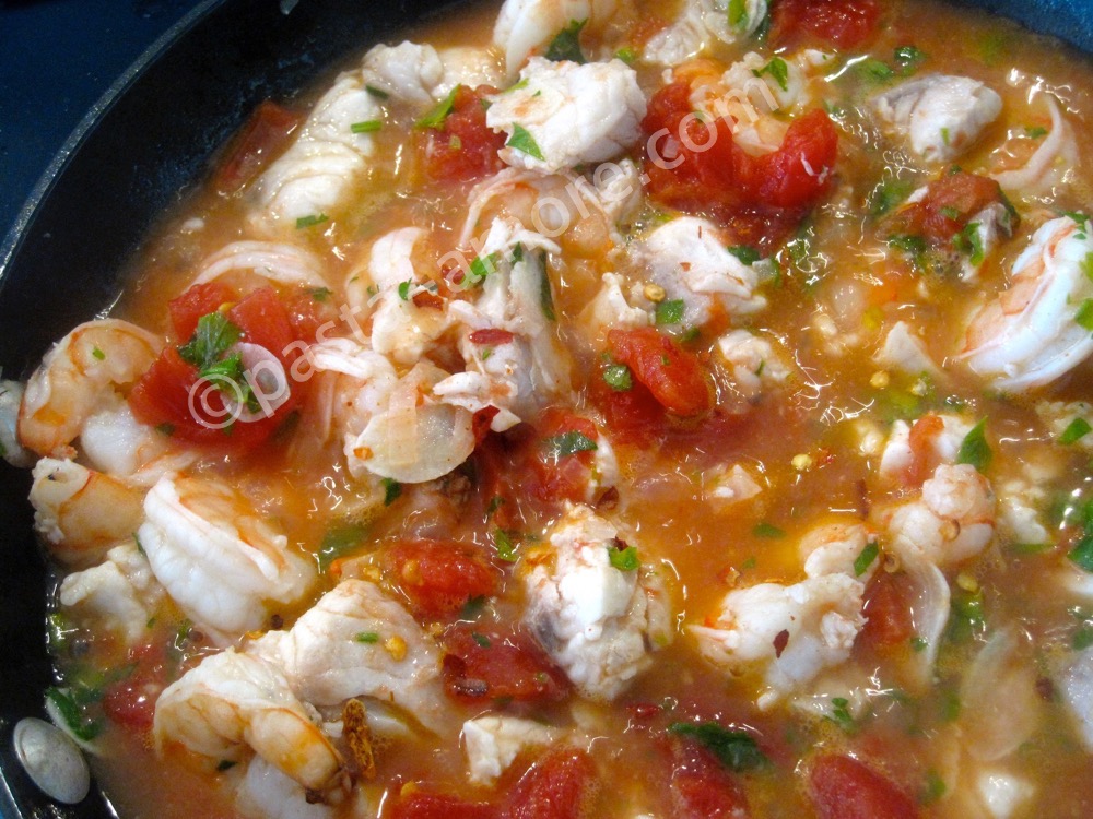 Sautéing the seafood soup step 4