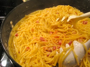 pour egg mixture in Carbonara