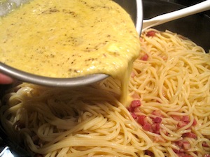 pour egg mixture in Carbonara