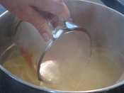 Scoop pasta water from boiling pasta